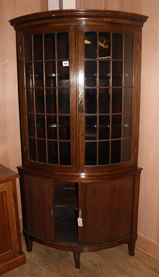 A Regency style mahogany bowfront corner cabinet, W.3ft 3in. H.6ft 4in.